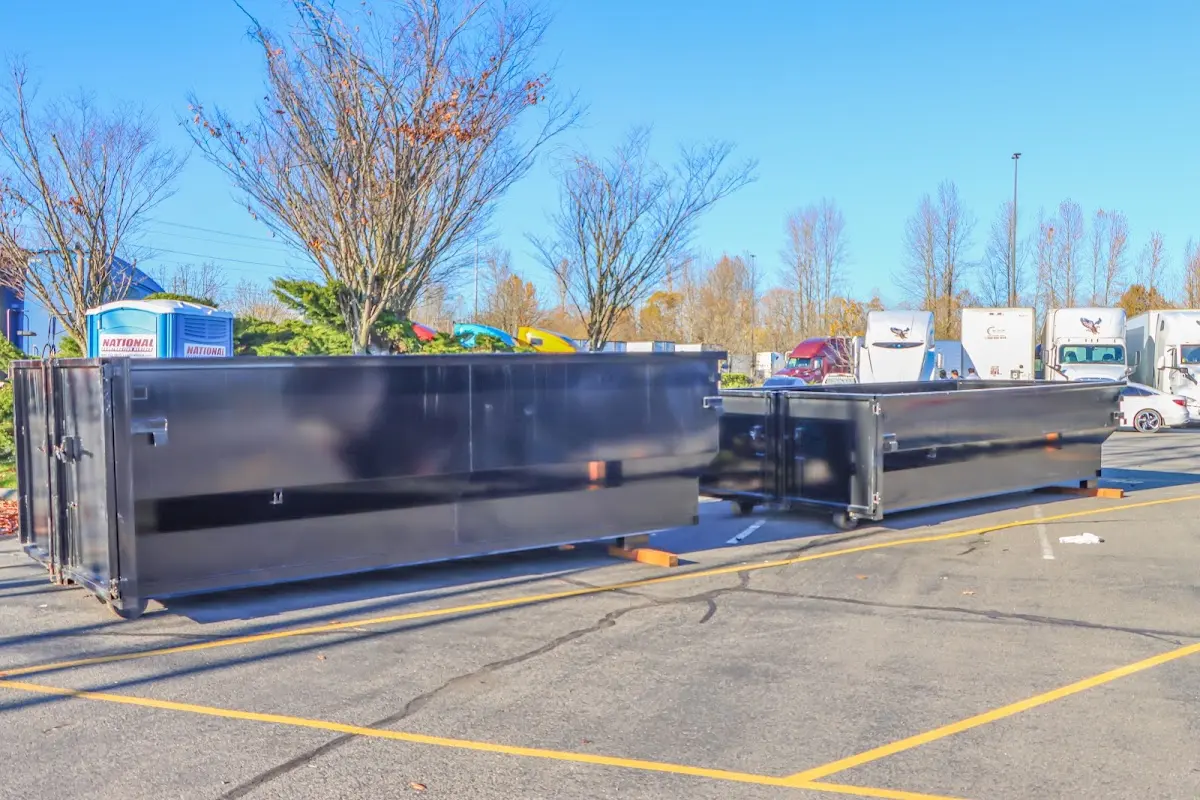 Professional dumpster rental service with roll-off container on residential driveway in Linthicum